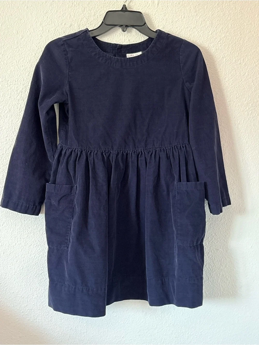 Hanna Andersson Fit & Flare Cotton Corduroy Dress in navy blue.